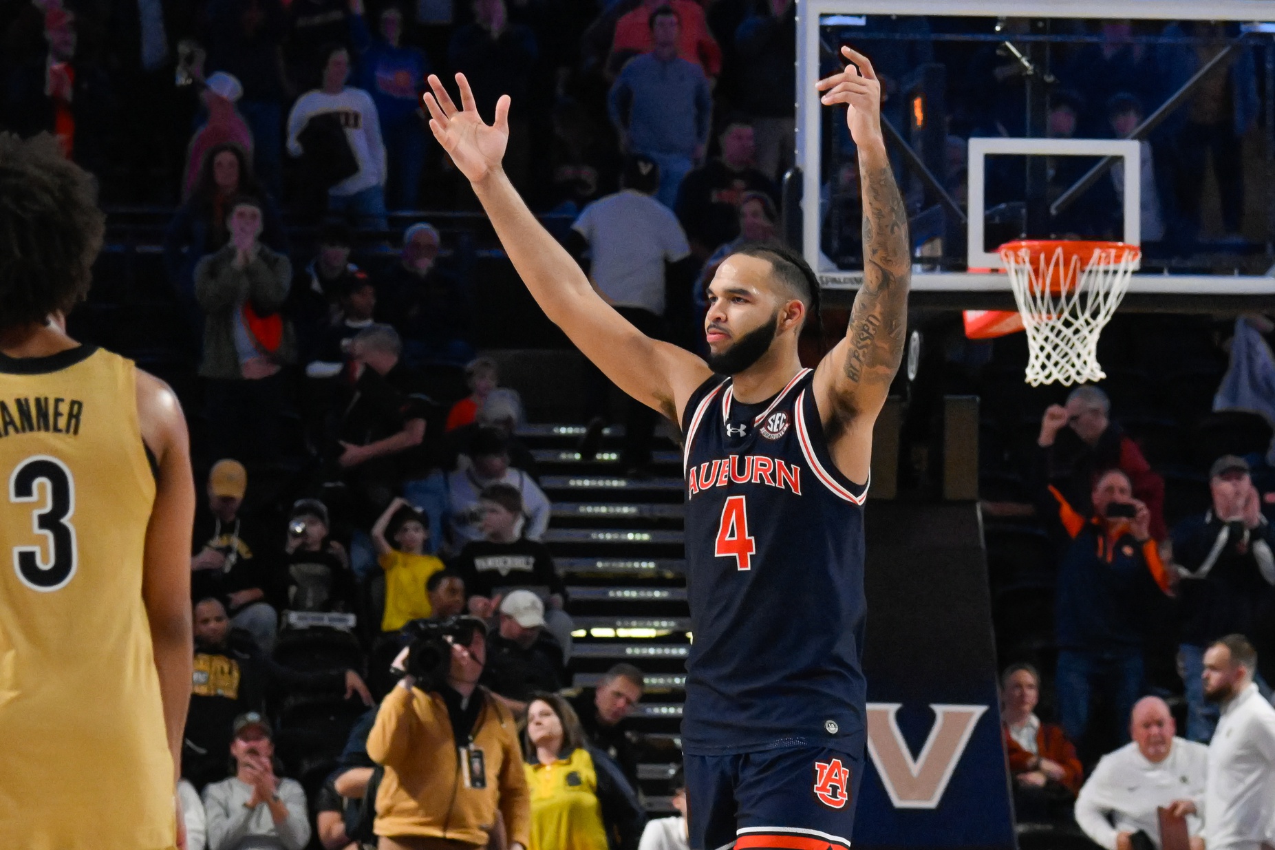 Auburn Tigers forward Johni Broome (4) gestures to the student section after the game against the Vanderbilt Commodores at Memorial Gymnasium.