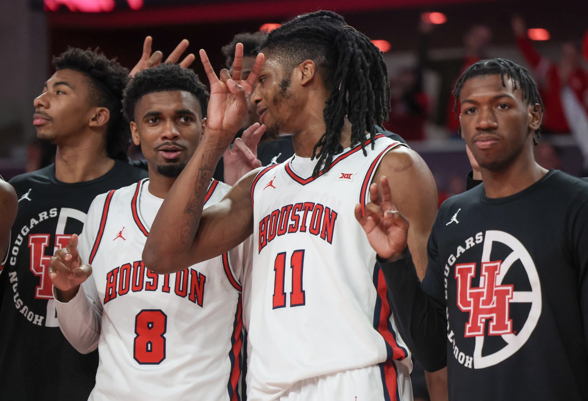 Houston Cougars forward Joseph Tugler (11) sings the school song with teammates after defeating the Iowa State Cyclones in the second half at Fertitta Center.