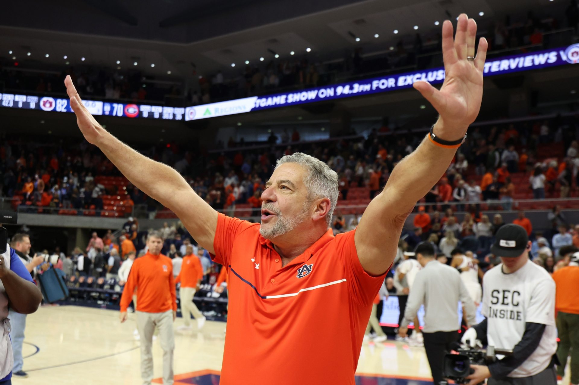 Auburn Tigers head coach Bruce Pearl celebrates the win after the game against the Georgia Bulldogs at Neville Arena.