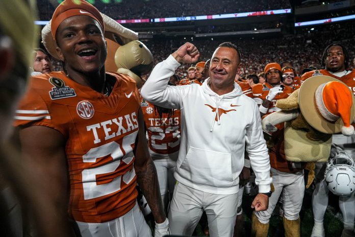 Texas Longhorns head coach Steve Sarkisian celebrates after defeating the Clemson Tigers in the first round of the College Football Playoffs at Darrell K Royal-Texas Memorial Stadium.