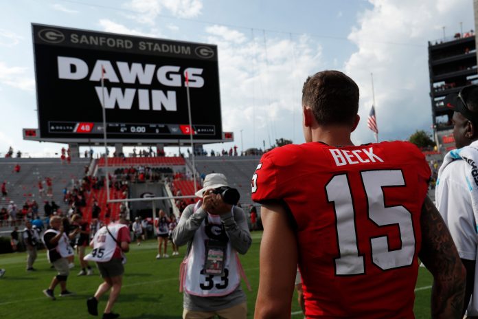 Georgia quarterback Carson Beck (15) heads to the locker room after a NCAA Aflac Kickoff game against Tennessee Tech in Athens, Ga., on Saturday, Sept. 7, 2024. Georgia won 48-3.