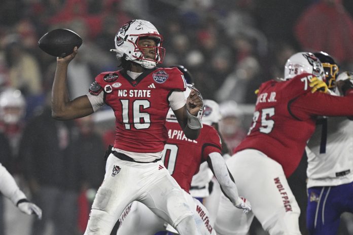 North Carolina State Wolfpack quarterback CJ Bailey (16) throws from the pocket during the first half of the the Go Bowling Military Bowl against the East Carolina Pirates at Navy-Marine Corps Memorial Stadium.