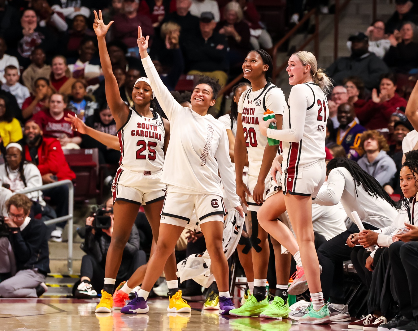 South Carolina Gamecocks guard Raven Johnson (25), guard Te-Hina Paopao (0), forward Sania Feagin (20) and forward Chloe Kitts (21) celebrate a play against the Arkansas Razorbacks in the second half at Colonial Life Arena.