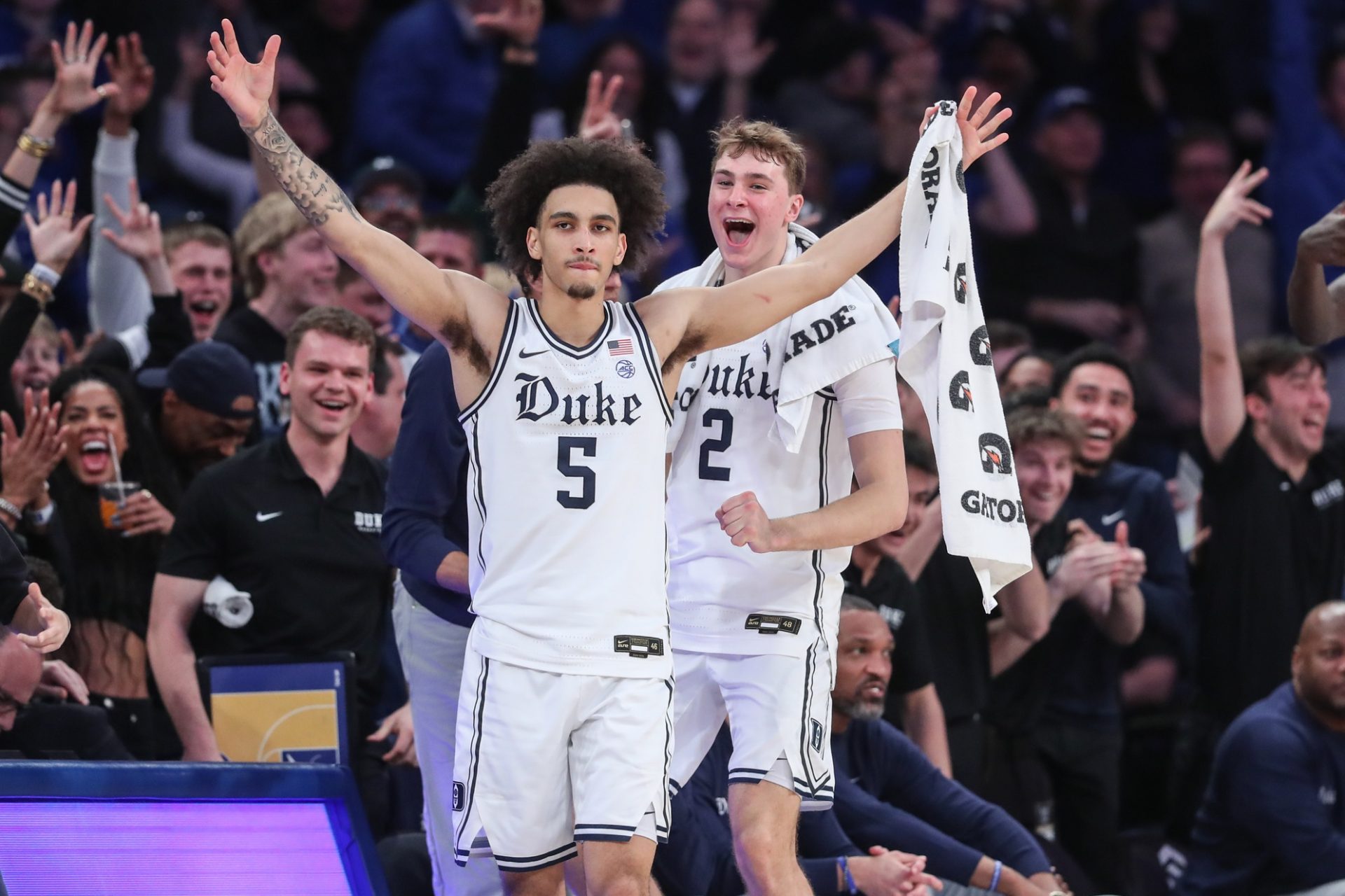 Duke Blue Devils guards Tyrese Proctor (5) and Cooper Flagg (2) celebrate from the bench in the second half against the Illinois Fighting Illini at Madison Square Garden.