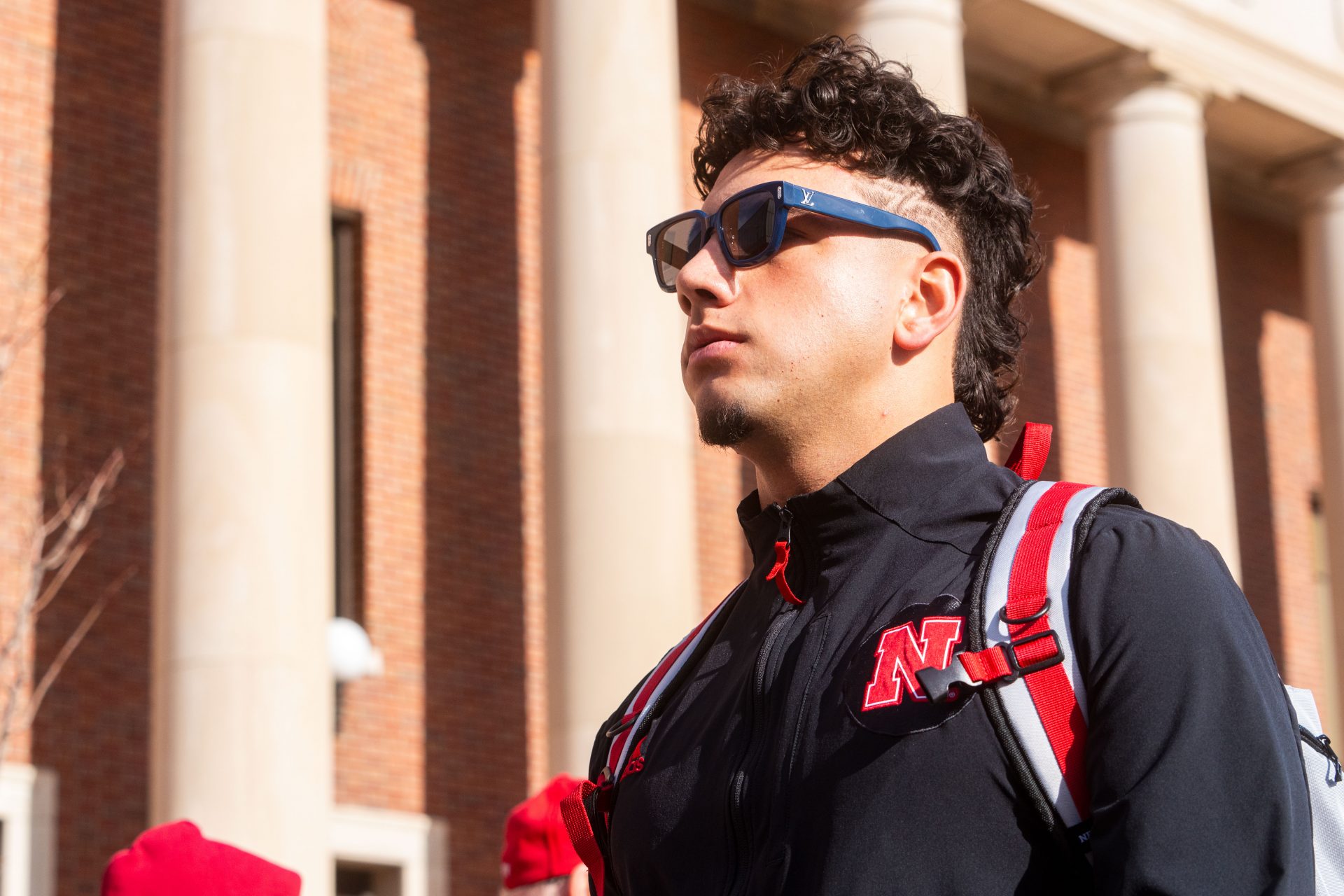 Face of the school's athletics programs, Nebraska quarterback Dylan Raiola celebrating the shocking and historic overtime win against Illinois in person.