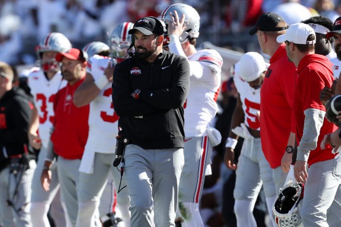 Ohio State Buckeyes head coach Ryan Day looks on from the sideline during the third quarter against the Penn State Nittany Lions at Beaver Stadium.