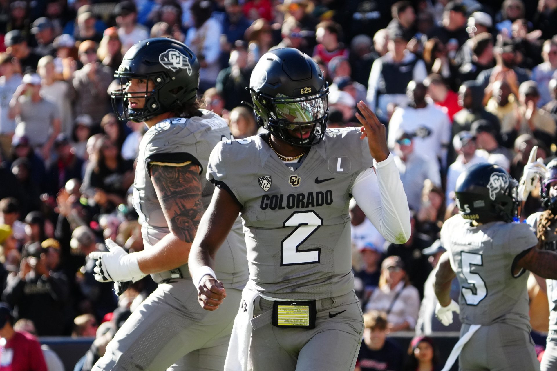 Colorado Buffaloes quarterback Shedeur Sanders (2) celebrates after a touchdown against the Arizona Wildcats in the second quarter at Folsom Field.