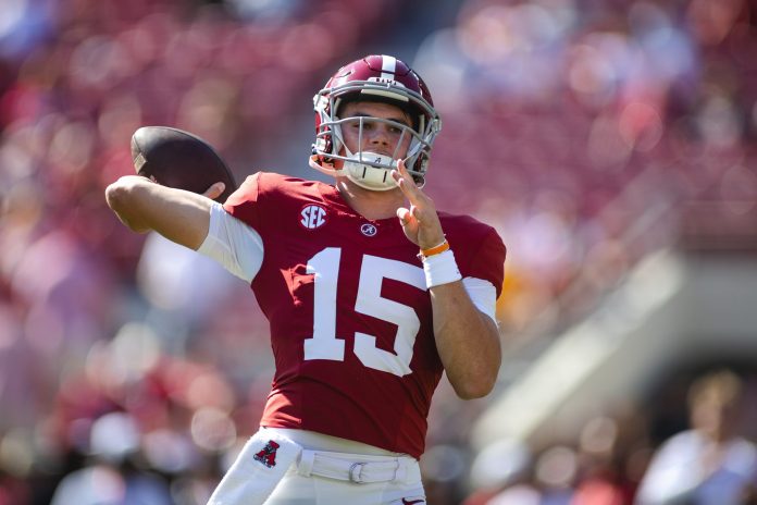 Alabama Crimson Tide quarterback Ty Simpson (15) makes a throw during warmups before a game against the Missouri Tigers at Bryant-Denny Stadium.