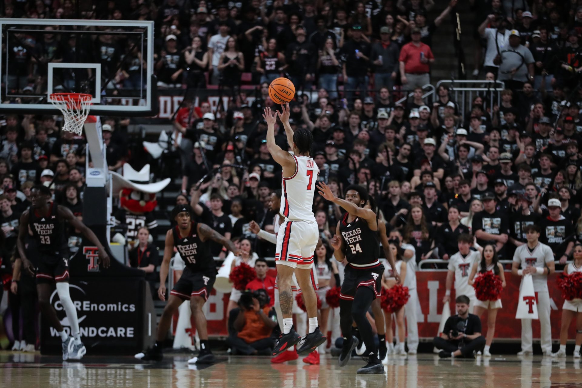 Houston Cougars guard Milos Uzan (7) makes a jump shot in front of Texas Tech Red Raiders guard Kerwin Walton (24) in the second half at United Supermarkets Arena.