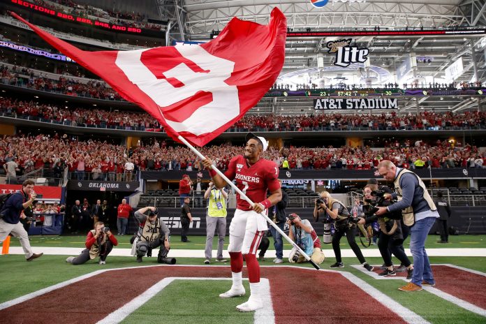 Oklahoma's Jalen Hurts (1) celebrates after the Big 12 Championship Game between the University of Oklahoma Sooners (OU) and the Baylor University Bears at AT&T Stadium in Arlington, Texas, Saturday, Dec. 7, 2019. Oklahoma won 30-23. [Bryan Terry/The Oklahoman]