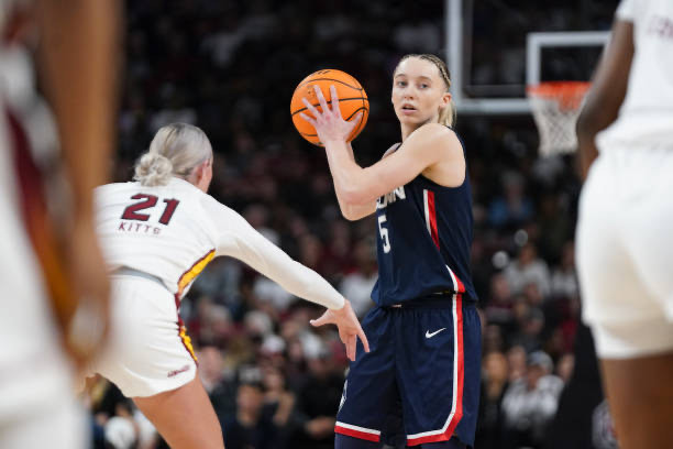 Paige Bueckers #5 of the UConn Huskies surveys the defense against Chloe Kitts #21 of the South Carolina Gamecocks during the third quarter an NCAA women's basketball game at Colonial Life Arena on February 16, 2025 in Columbia, South Carolina. The UConn Huskies won 87-58.