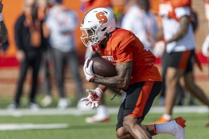 National team running back LeQuint Allen Jr. of Syracuse (24) runs the ball during Senior Bowl practice for the National team at Hancock Whitney Stadium.