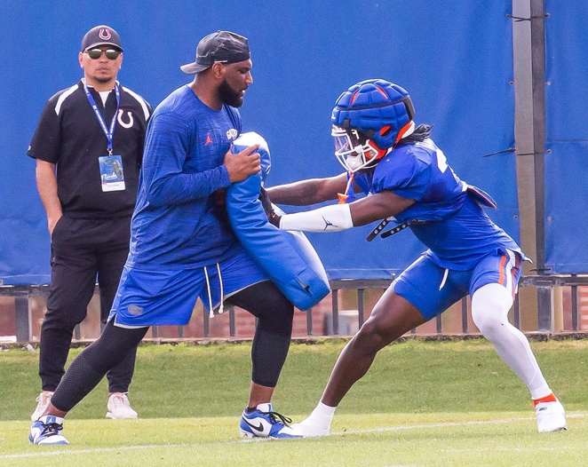 New Florida secondary coach Will Harris runs a drill with one of his defensive backs during the Florida Gators as they held their final open Spring football practice before the Orange and Blue Game at Sanders Practice Fields in Gainesville, FL on Tuesday, April 9, 2024. [Doug Engle/Gainesville Sun]