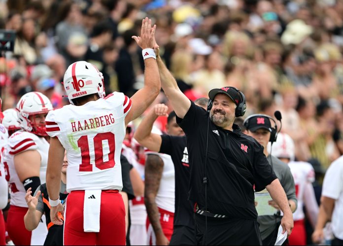 Nebraska Cornhuskers head coach Matt Rhule high fives quarterback Heinrich Haarberg (10) during the first quarter against the Purdue Boilermakers at Ross-Ade Stadium.