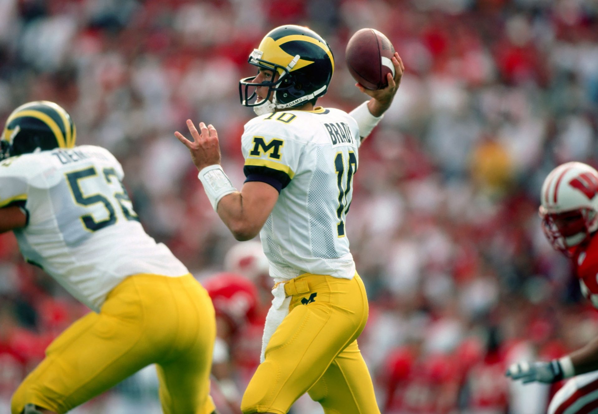 Sep 25, 1999; Madison, WI, USA; FILE PHOTO; Michigan Wolverines quarterback Tom Brady (10) in action against the Wisconsin Badgers at Camp Randall Stadium. Michigan defeated Wisconsin 21-16. Mandatory Credit: Photo By USA TODAY Sports