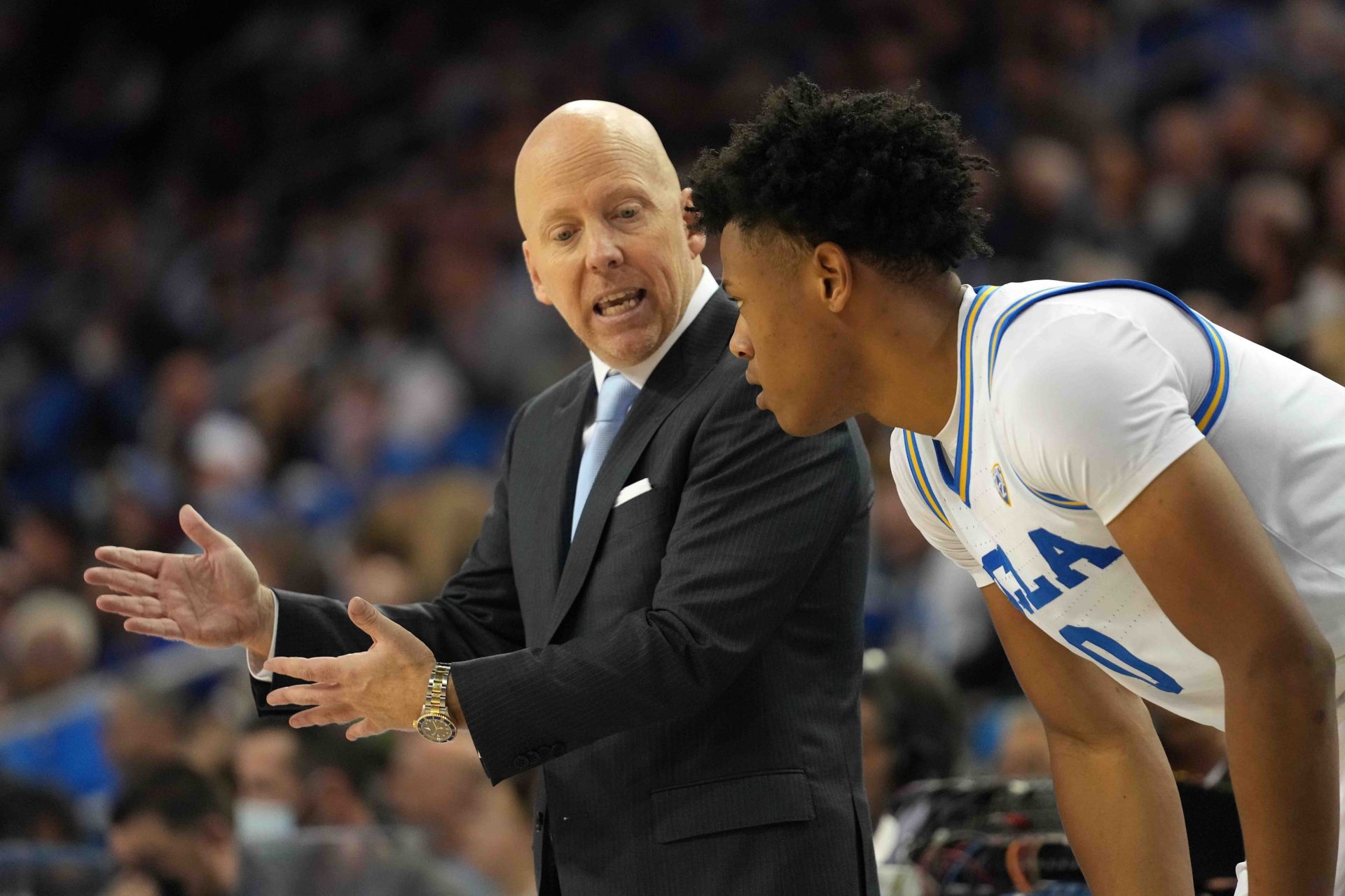 UCLA Bruins head coach Mick Cronin (left) talks with guard Jaylen Clark (0) against the Colorado Buffaloes in the second half at Pauley Pavilion.