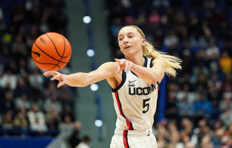 UConn Huskies guard Paige Bueckers (5) passes the ball against the Georgetown Hoyas in the first half at XL Center.