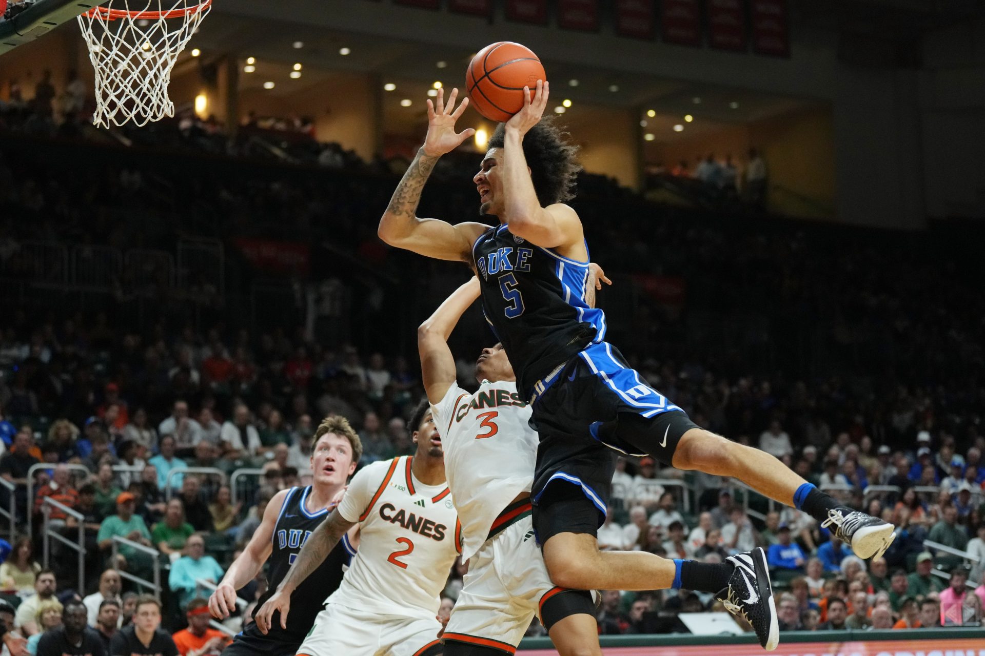 Duke Blue Devils guard Tyrese Proctor (5) gets fouled by Miami (Fl) Hurricanes guard Jalil Bethea (3) during the first half at Watsco Center.