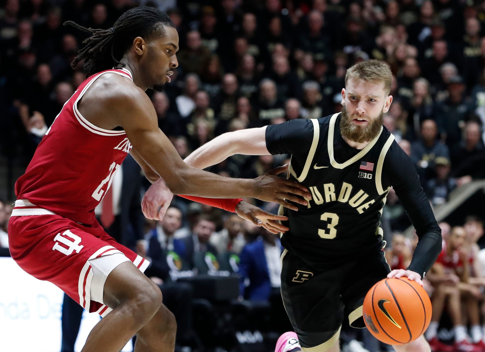 Indiana Hoosiers forward Mackenzie Mgbako (21) defends Purdue Boilermakers guard Braden Smith (3) Friday, Jan. 31, 2025, during the NCAA men’s basketball game at Mackey Arena in West Lafayette, Ind. Purdue Boilermakers won 81-76.