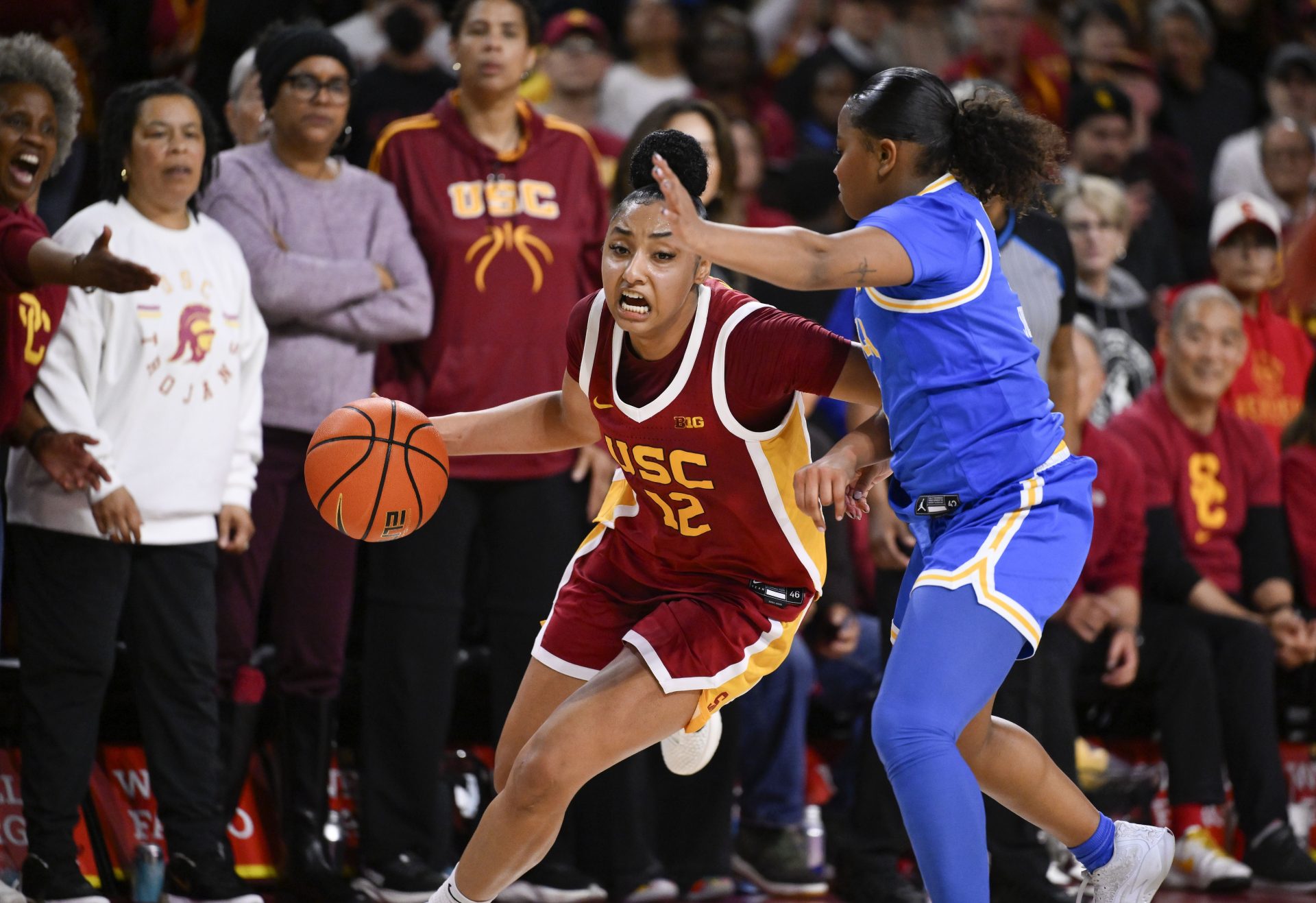 USC Trojans guard JuJu Watkins (12) dribbles against UCLA Bruins guard Londynn Jones (3) during the fourth quarter at Galen Center.