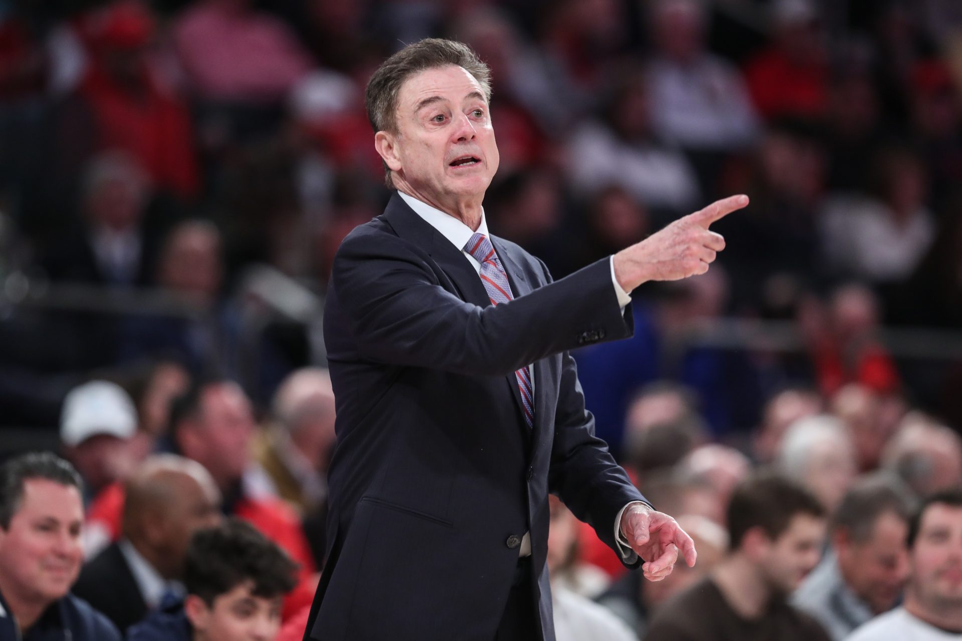 St. John's Red Storm head coach Rick Pitino signals to the team in the first half against the Providence Friars at Madison Square Garden.