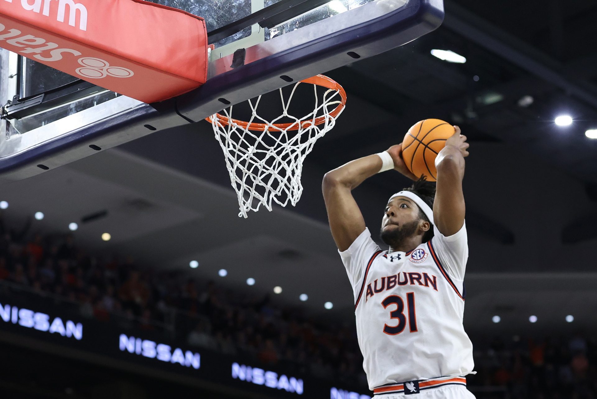 Auburn Tigers forward Chaney Johnson (31) goes for a dunk against the Arkansas Razorbacks during the second half at Neville Arena.