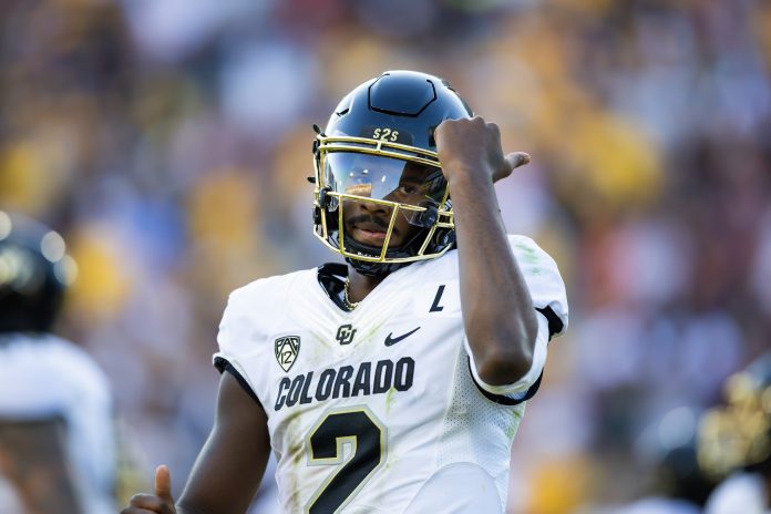 Colorado Buffaloes quarterback Shedeur Sanders (2) celebrates after scoring a touchdown against the Arizona State Sun Devils in the first half at Mountain America Stadium, Home of the ASU Sun Devils.