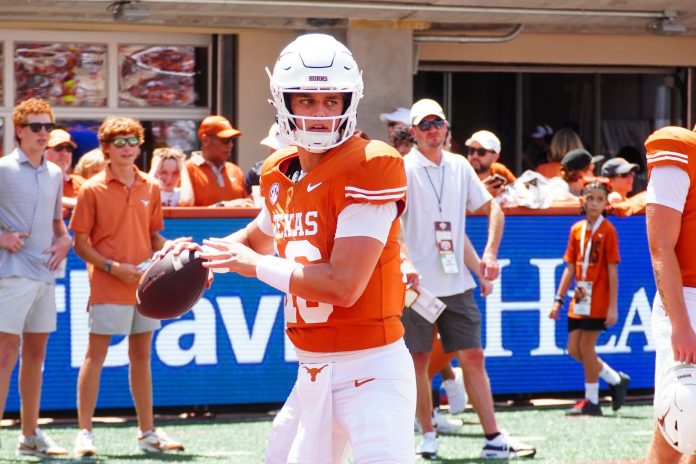 Texas Longhorns quarterback Arch Manning (16) warms up before a game against Colorado State at Darrell K Royal-Texas Memorial Stadium.