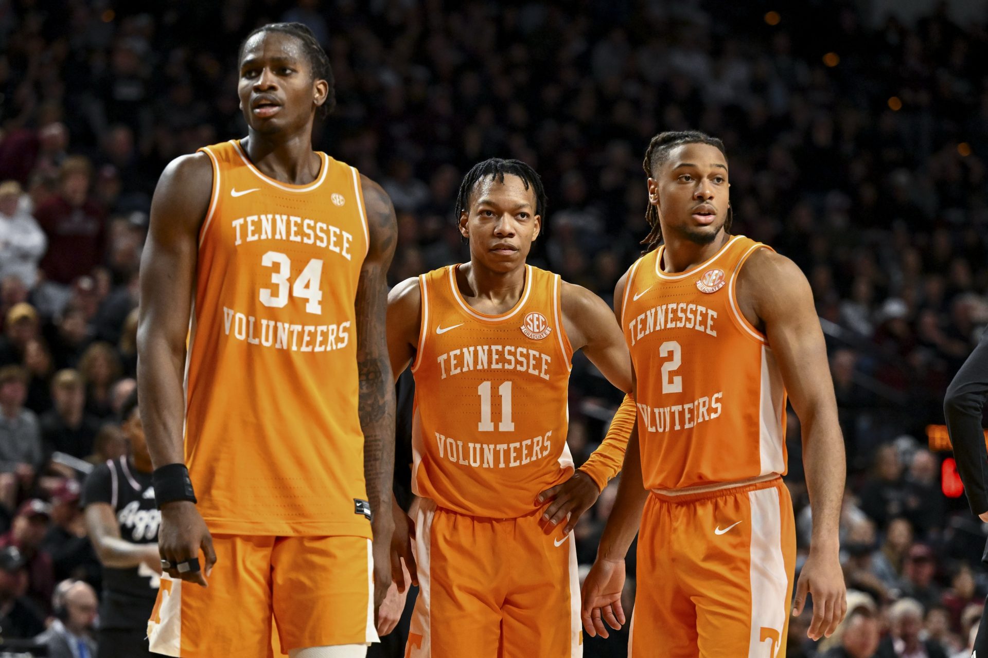 Tennessee Volunteers guard Chaz Lanier (2), guard Jordan Gainey (11) and forward Felix Okpara (34) stand on the court during a time-out in the second half against the Texas A&M Aggies at Reed Arena.