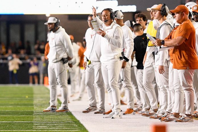 Texas Longhorns head coach Steve Sarkisian looks at his play chart against the Vanderbilt Commodores during the second half at FirstBank Stadium.