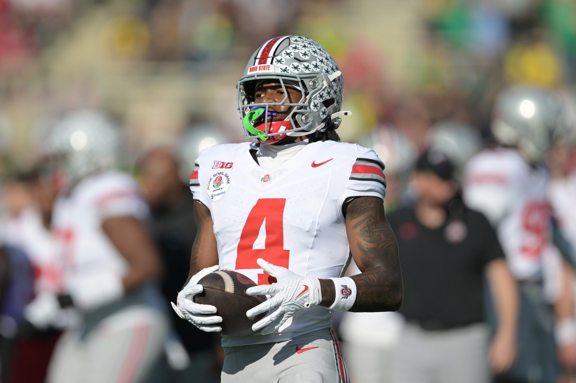 Ohio State Buckeyes wide receiver Jeremiah Smith (4) warms up before the 2025 Rose Bowl college football quarterfinal game against the Oregon Ducks at Rose Bowl Stadium.