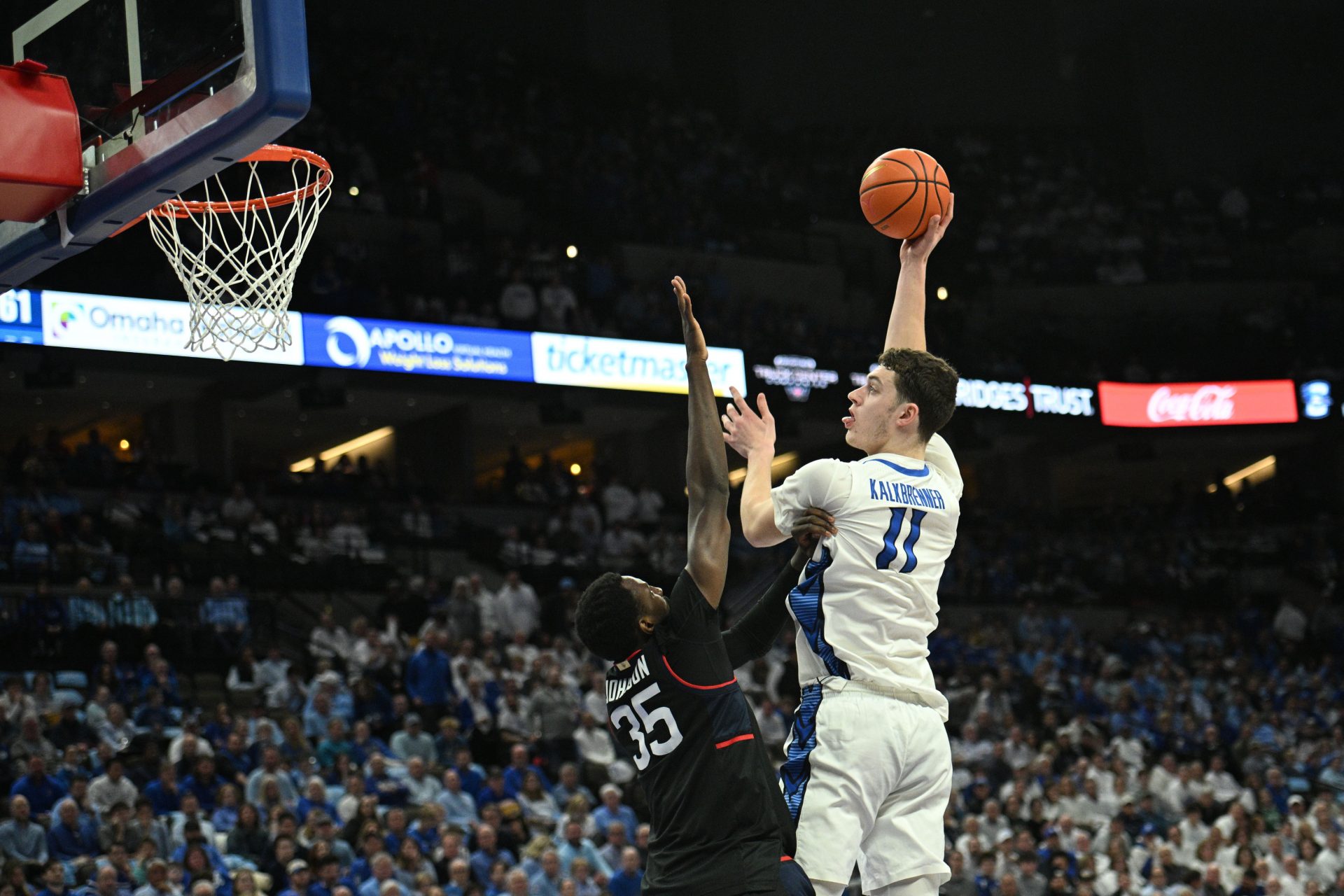 Creighton Bluejays center Ryan Kalkbrenner (11) shoots over Connecticut Huskies center Samson Johnson (35) during the second half at CHI Health Center Omaha.