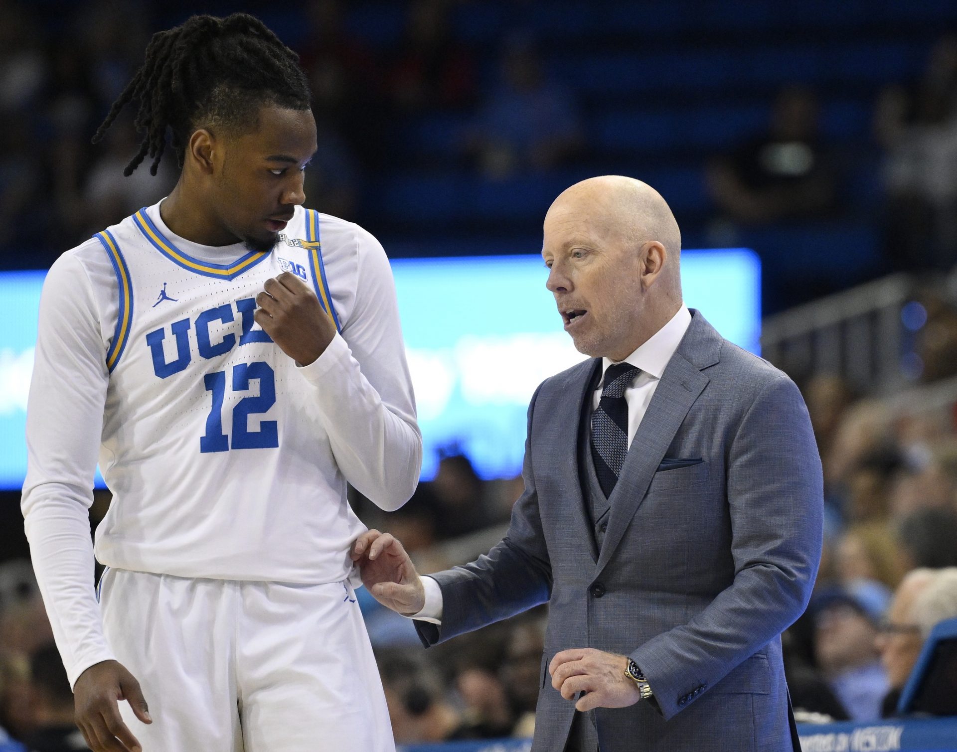 UCLA Bruins head coach Mick Cronin talks to UCLA Bruins guard Sebastian Mack (12) during the second half at Pauley Pavilion presented by Wescom.