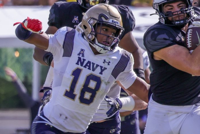 Navy Midshipmen safety Rayuan Lane III (18) moves in against UCF Knights running back Isaiah Bowser (5) during the second half at FBC Mortgage Stadium.