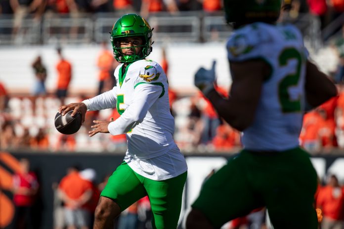 Oregon quarterback Dante Moore looks to pass as the Oregon State Beavers host the Oregon Ducks.