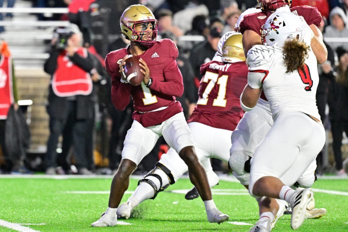 Boston College Eagles quarterback Thomas Castellanos (1) throws a pass against the Louisville Cardinals during the first half at Alumni Stadium.