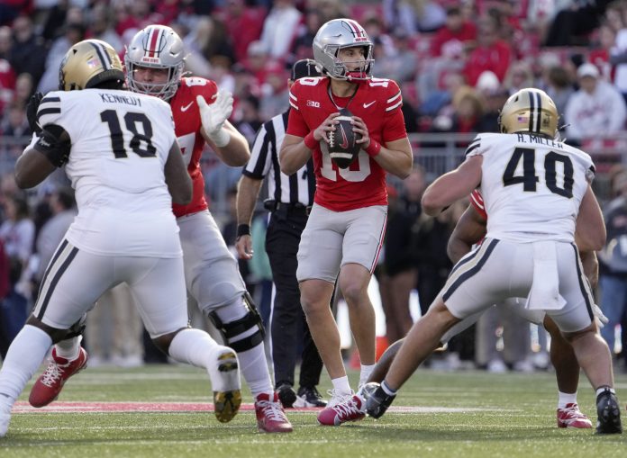 Ohio State Buckeyes quarterback Julian Sayin (10) looks for an open man during the second half at Ohio Stadium.