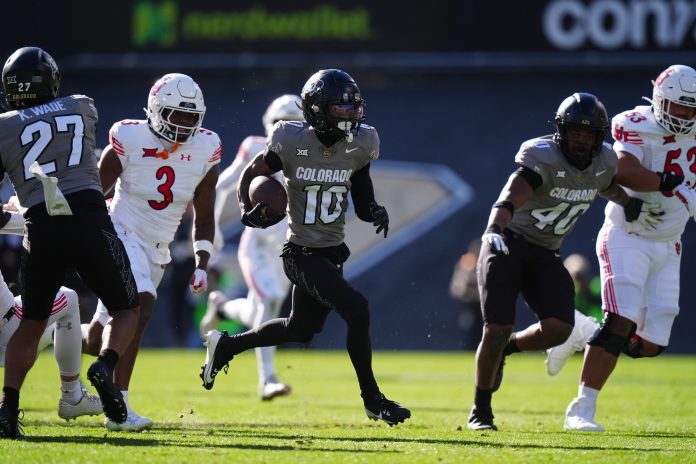 Colorado Buffaloes wide receiver LaJohntay Wester (10) returns a punt for a touchdown in the first quarter against the Utah Utes at Folsom Field.