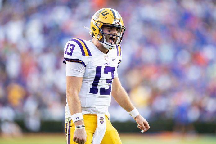 LSU Tigers quarterback Garrett Nussmeier (13) celebrates after a score against the Florida Gators during the first half at Ben Hill Griffin Stadium.