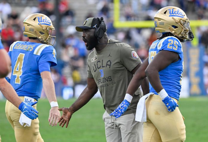 UCLA Bruins head coach DeShaun Foster greets quarterback Ethan Garbers (4) during the third quarter against the Fresno State Bulldogs at Rose Bowl.