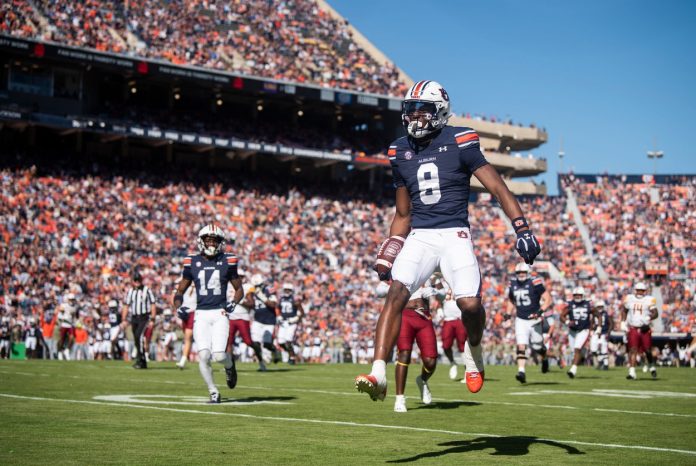 Auburn Tigers wide receiver Cam Coleman (8) jumps into the end zone for a touchdown after a catch as Auburn Tigers take on Louisiana-Monroe Warhawks at Jordan-Hare Stadium in Auburn, Ala., on Saturday, Nov. 16, 2024.Auburn Tigers wide receiver Cam Coleman (8) jumps into the end zone for a touchdown after a catch as Auburn Tigers take on Louisiana-Monroe Warhawks at Jordan-Hare Stadium in Auburn, Ala., on Saturday, Nov. 16, 2024.