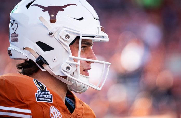 Texas Longhorns quarterback Arch Manning (16) warms up as the Texas Longhorns prepare to play the Clemson Tigers in the first round of the College Football Playoffs at Darrell K Royal Texas Memorial Stadium in Austin, Texas.