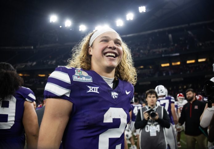 Kansas State Wildcats quarterback Avery Johnson (2) celebrates after defeating the Rutgers Scarlet Knights during the Rate Bowl at Chase Field.