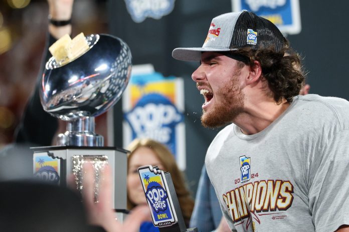 owa State Cyclones quarterback Rocco Becht (3) celebrates after beating Miami Hurricanes in the Pop Tarts bowl at Camping World Stadium.