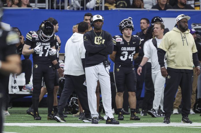 Colorado Buffaloes head coach Deion Sanders reacts from the sideline during the third quarter against the Brigham Young Cougars at Alamodome.