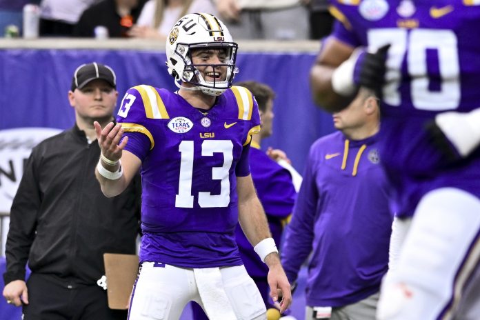 LSU Tigers quarterback Garrett Nussmeier (13) reacts after throwing a touchdown pass during the first half against the Baylor Bears at NRG Stadium. The Tigers defeat the Bears 44-31.