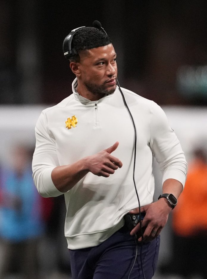 Notre Dame Fighting Irish head coach Marcus Freeman reacts against the Ohio State Buckeyes in the second half in the CFP National Championship college football game at Mercedes-Benz Stadium.