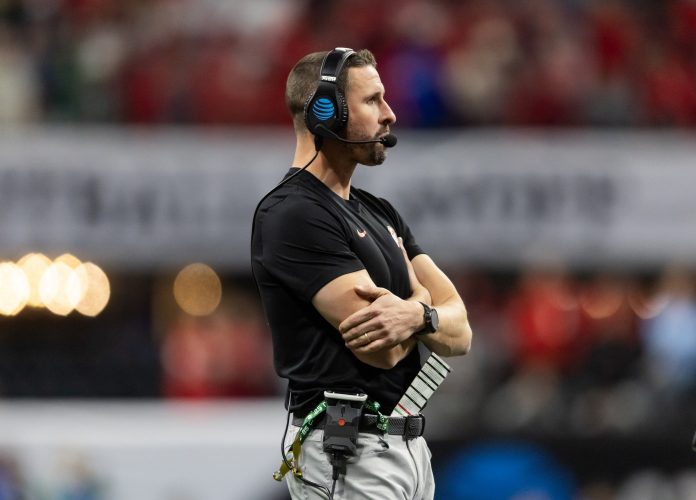 Ohio State Buckeyes wide receivers coach Brian Hartline against the Notre Dame Fighting Irish during the CFP National Championship college football game at Mercedes-Benz Stadium.