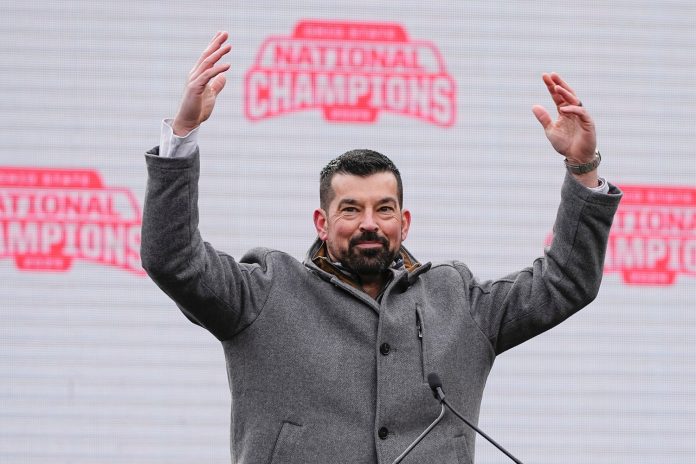 Head coach Ryan Day fires up the crowd during the Ohio State Buckeyes College Football Playoff National Championship celebration at Ohio Stadium.