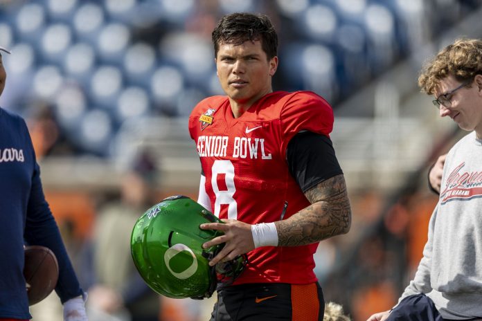 National team quarterback Dillon Gabriel of Oregon (8) pauses after practice during Senior Bowl practice for the National team at Hancock Whitney Stadium.